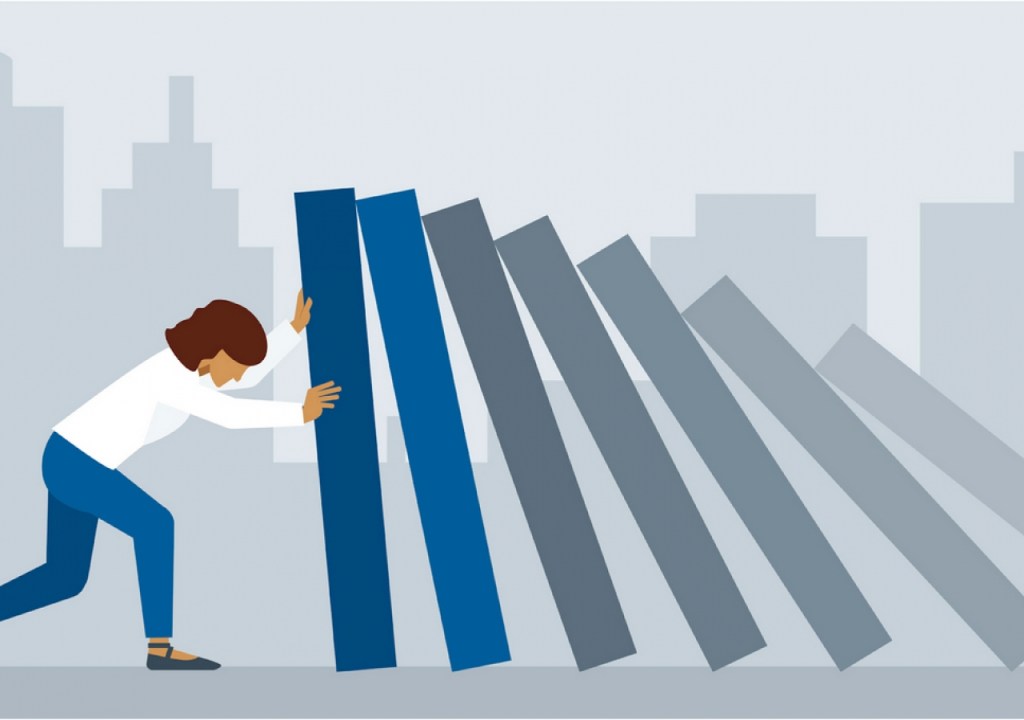 Person pushing against falling pillars